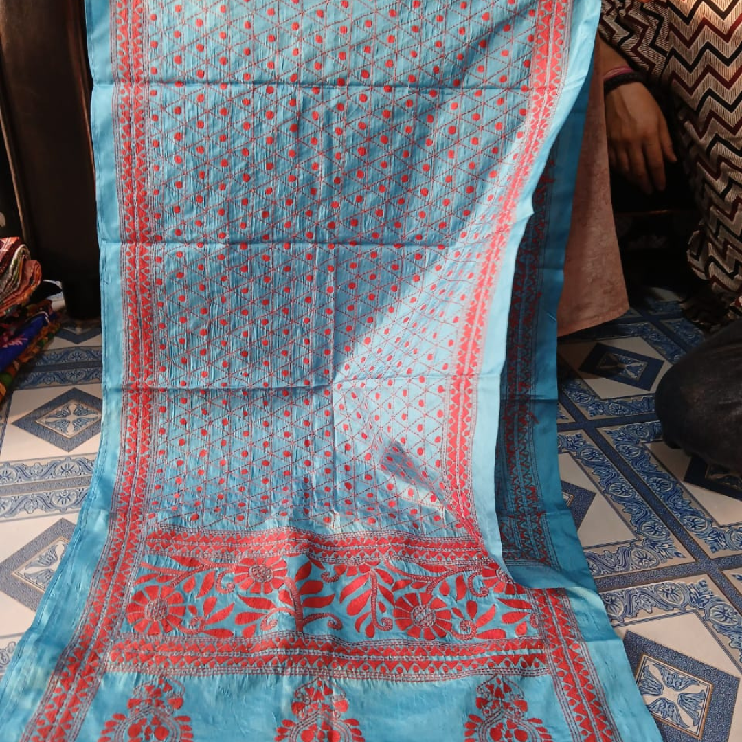 Blue silk stole with red floral pattern.