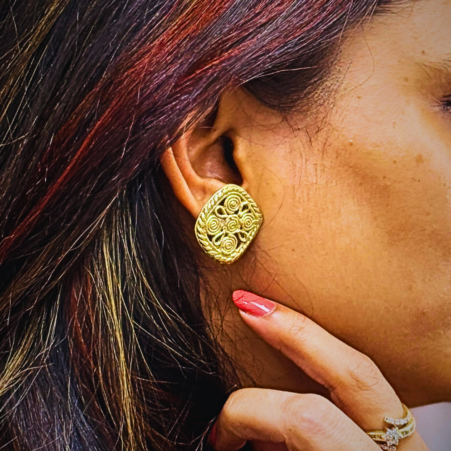 Woman wearing handcrafted dokra ear ring