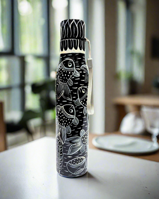 Black and white patterned water bottle with fish design on a white background