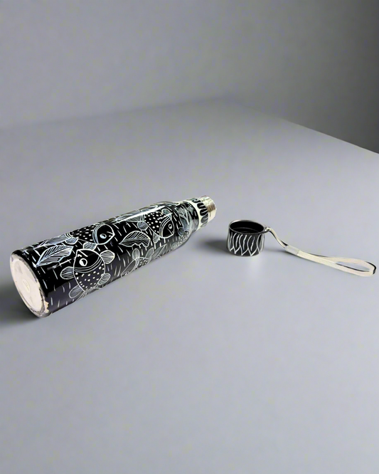 Black and white patterned steel water bottle with carrying strap on a white background