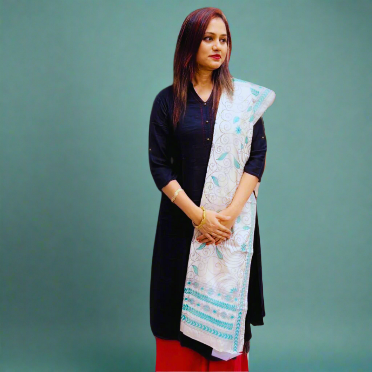 Indian woman wearing ethnic handcrafted artisanal made stole teal color