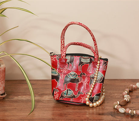 Embossed Leather Potli Bag for Women from Birbhum - Black Camel on Red - ArtisanSoul