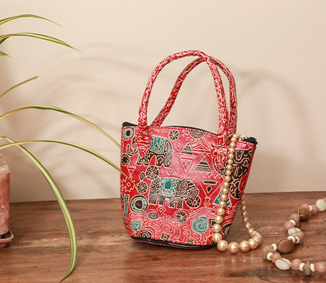 Embossed Leather Potli Bag for Women from Birbhum - Elephant on Red - ArtisanSoul