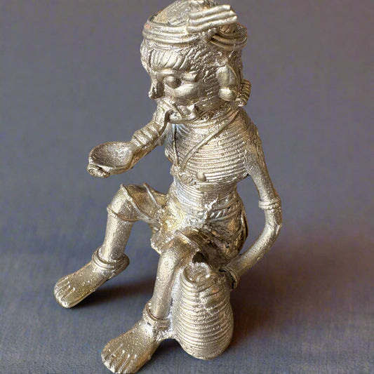 Handcrafted Dokra brass figurine of tribal musician man playing instrument, made in Dhenkanal, Odisha