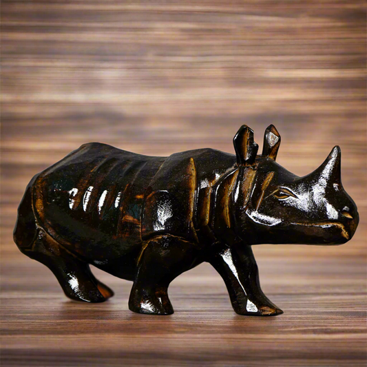 Handcarved wooden rhino figurine in dark brown – tribal art sculpture from Assam, India