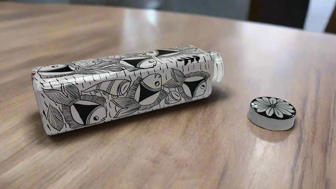 Black and white patterned bottle on a white surface