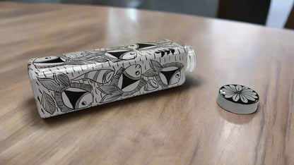 Black and white patterned bottle on a white surface