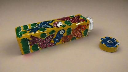 Colorful water bottle with artistic design on a white surface