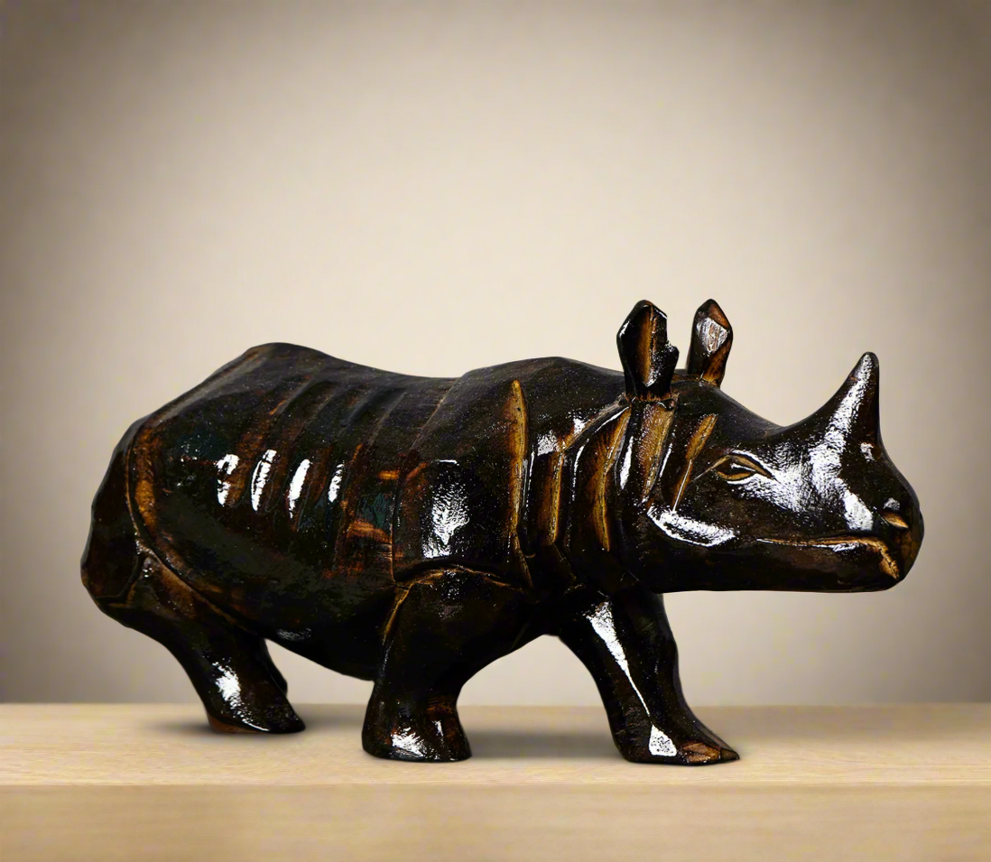 Handcarved wooden rhino figurine in dark brown – tribal art sculpture from Assam, India